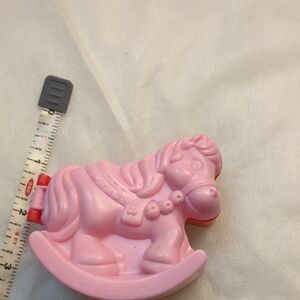 vintage rocking horse which opens to reveal a cabbage patch doll themed scene.